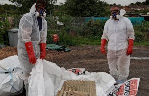 Peter New and Andrew Redden remove the asbestos web